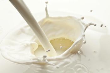 Splash of milk photo. Closeup. | Image Credit: © volff - stock.adobe.com