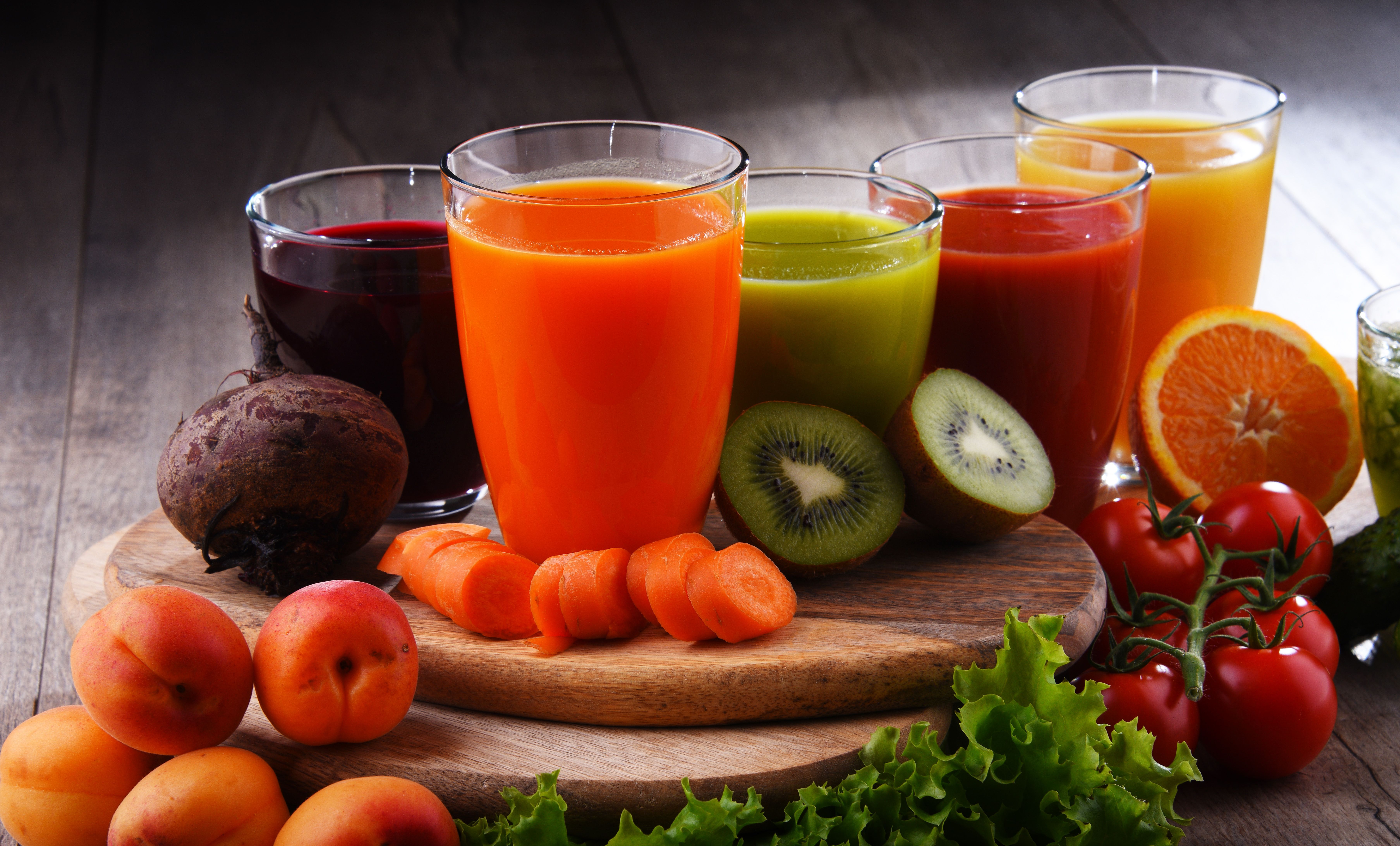 Glasses with fresh organic vegetable and fruit juices