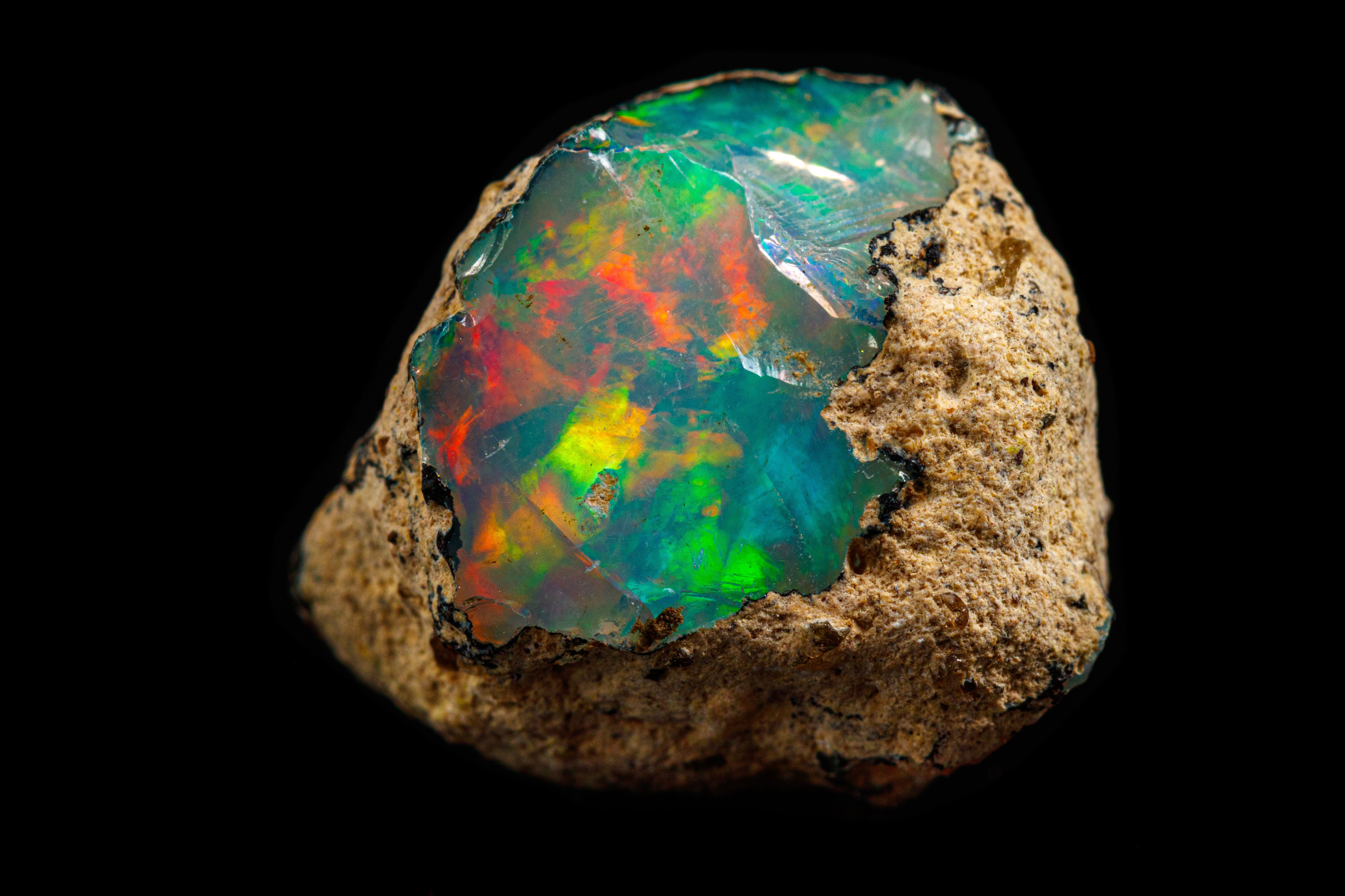 rare earths metal poking out of rock