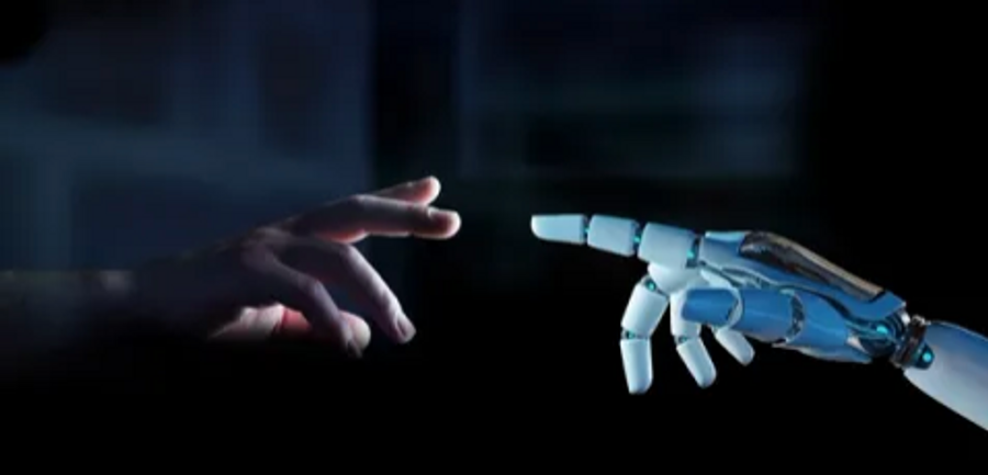 a human hand reaching out to touch a robotic hand