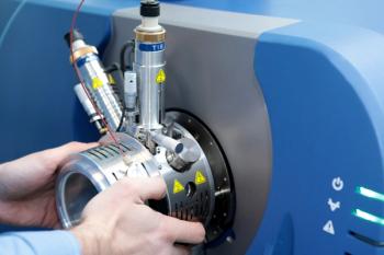 Adjust the mass spectrometer. The man analyzes the device for determining the masses of atoms. Device for the pharmaceutical industry. Ionic source of mass spectrometer. | Image Credit: © neznamov1984 - stock.adobe.com