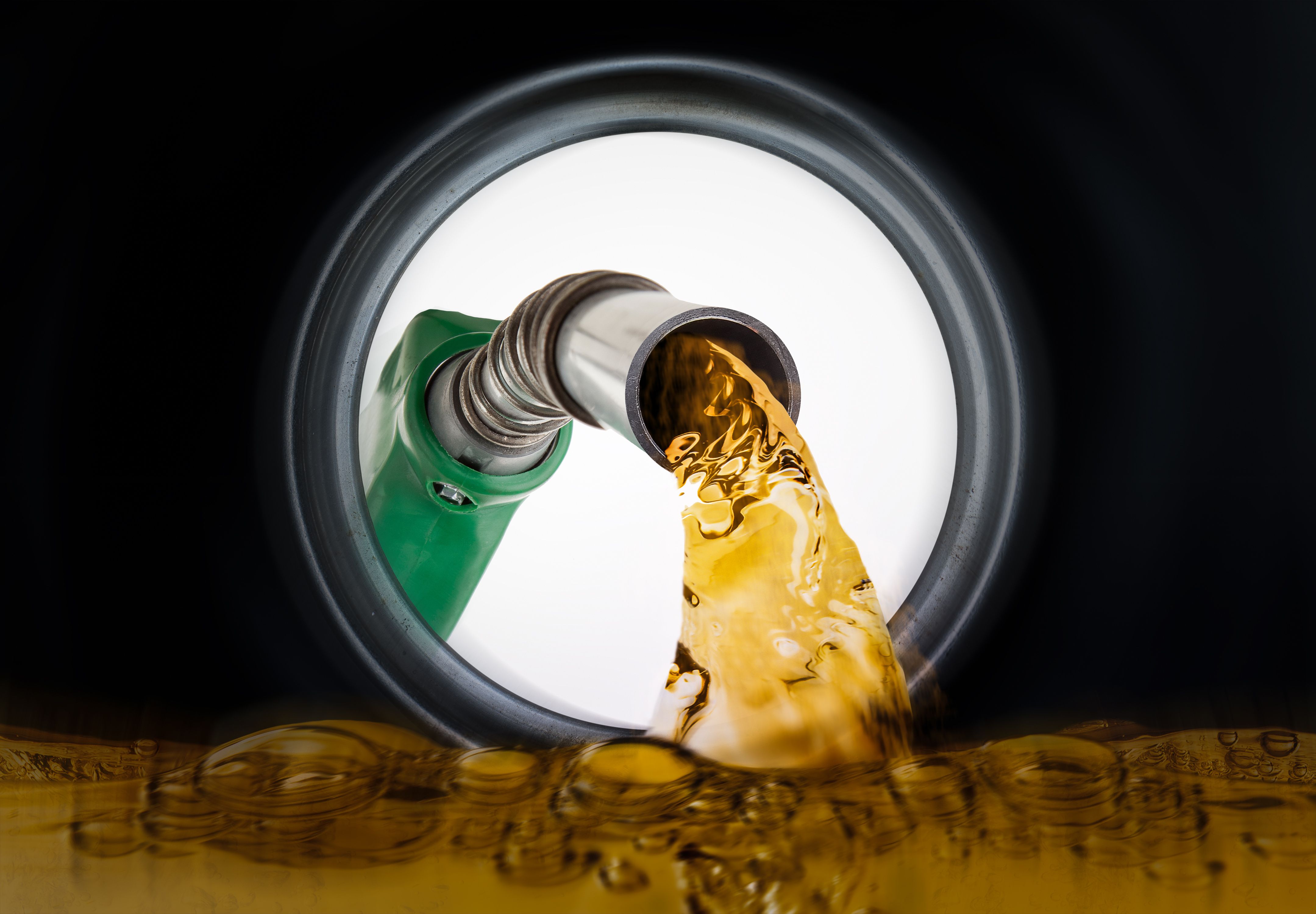 Refilling fuel view from inside of gas tank of a car | Image Credit: © nexusseven - stock.adobe.com