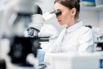 Young female medic in uniform working with microscope making analysis at the laboratory office | Image Credit: © rh2010 - stock.adobe.com