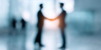 Blurred image of businesspeople shaking hands. Professional Business Agreement Concept | Image Credit: © narumon - stock.adobe.com.