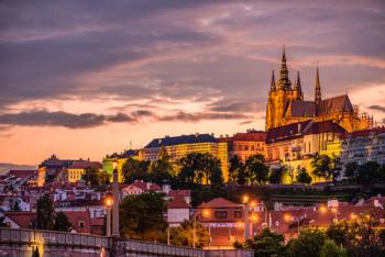 Cityscape of Prague with the famous castle during sunset. | Image Credit: © Ondrej Bucek - stock.adobe.com.