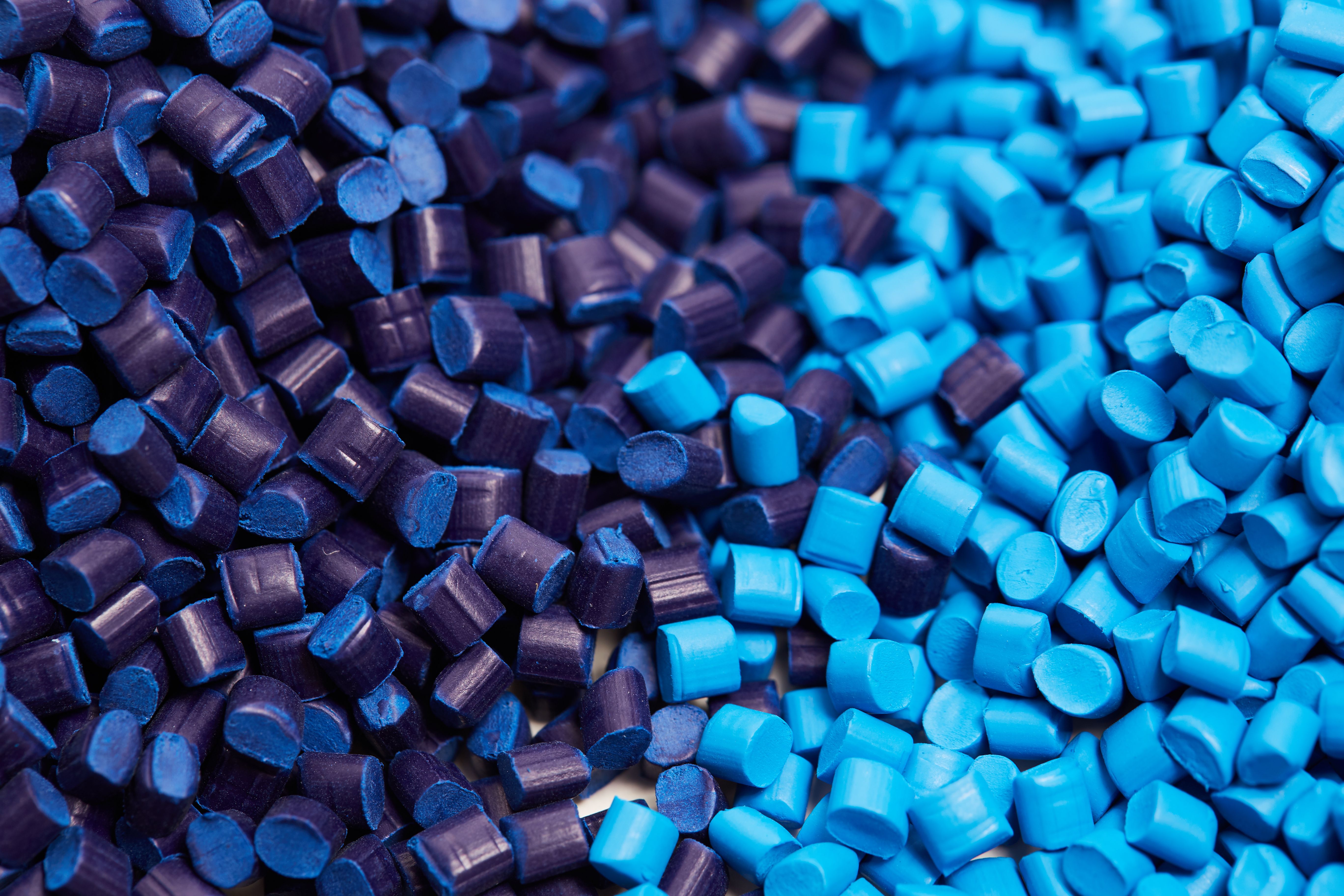 Close up of a two stacks of blue plastic polypropylene granules on a table | Image Credit: © LS Visuals - stock.adobe.com