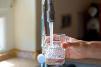 Woman filling a glass of water from a tap | Image Credit: © michaelheim