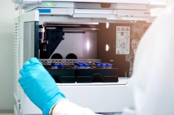 Vials (small bottle) in tray inside injection section of High Performance Liquid Chromatography (HPLC) instrument, chemistry analytical experiment concept | Image Credit: © Stella - stock.adobe.com