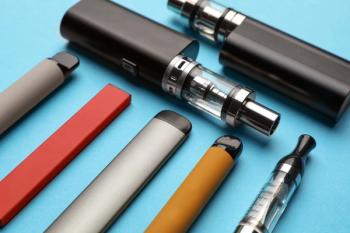 Different electronic cigarettes on light blue background, closeup | Image Credit: © New Africa - stock.adobe.com