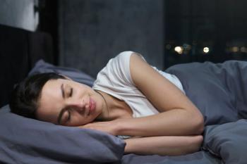 Young female sleeping peacefully in her bedroom at night, relaxing | Image Credit: © Damir Khabirov - stock.adobe.com