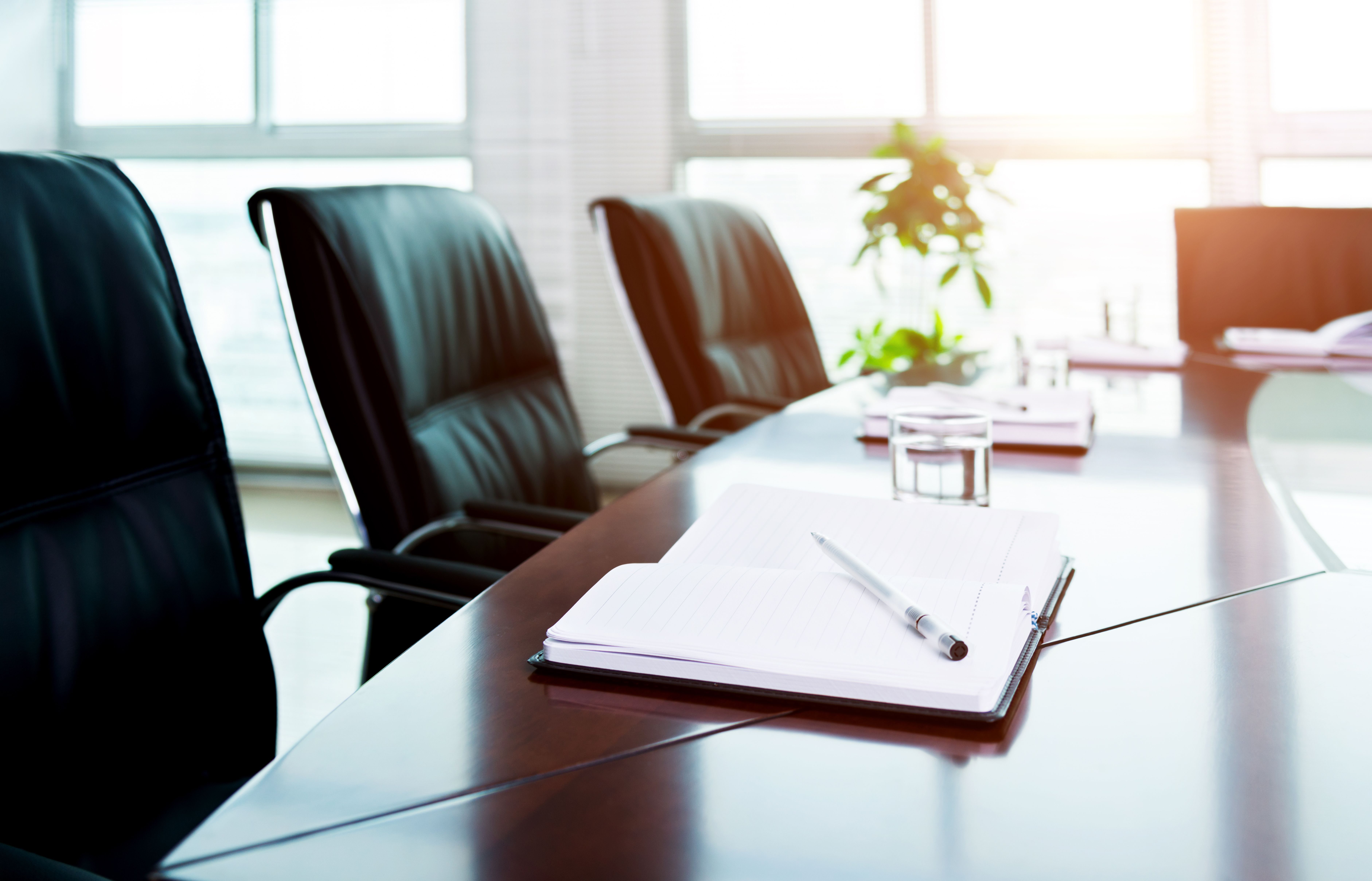 Notebook with pen in meeting room | Image Credit: © xy - stock.adobe.com