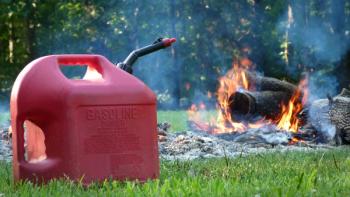 Gasoline Can in front of a Fire, Fire Hazard, Burning Hazard | Image Credit: © Alissa Yarbrough - stock.adobe.com