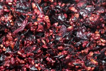 Pressed grape pomace, seeds and skins. Winemaking background. | Image Credit: © aquatarkus - stock.adobe.com