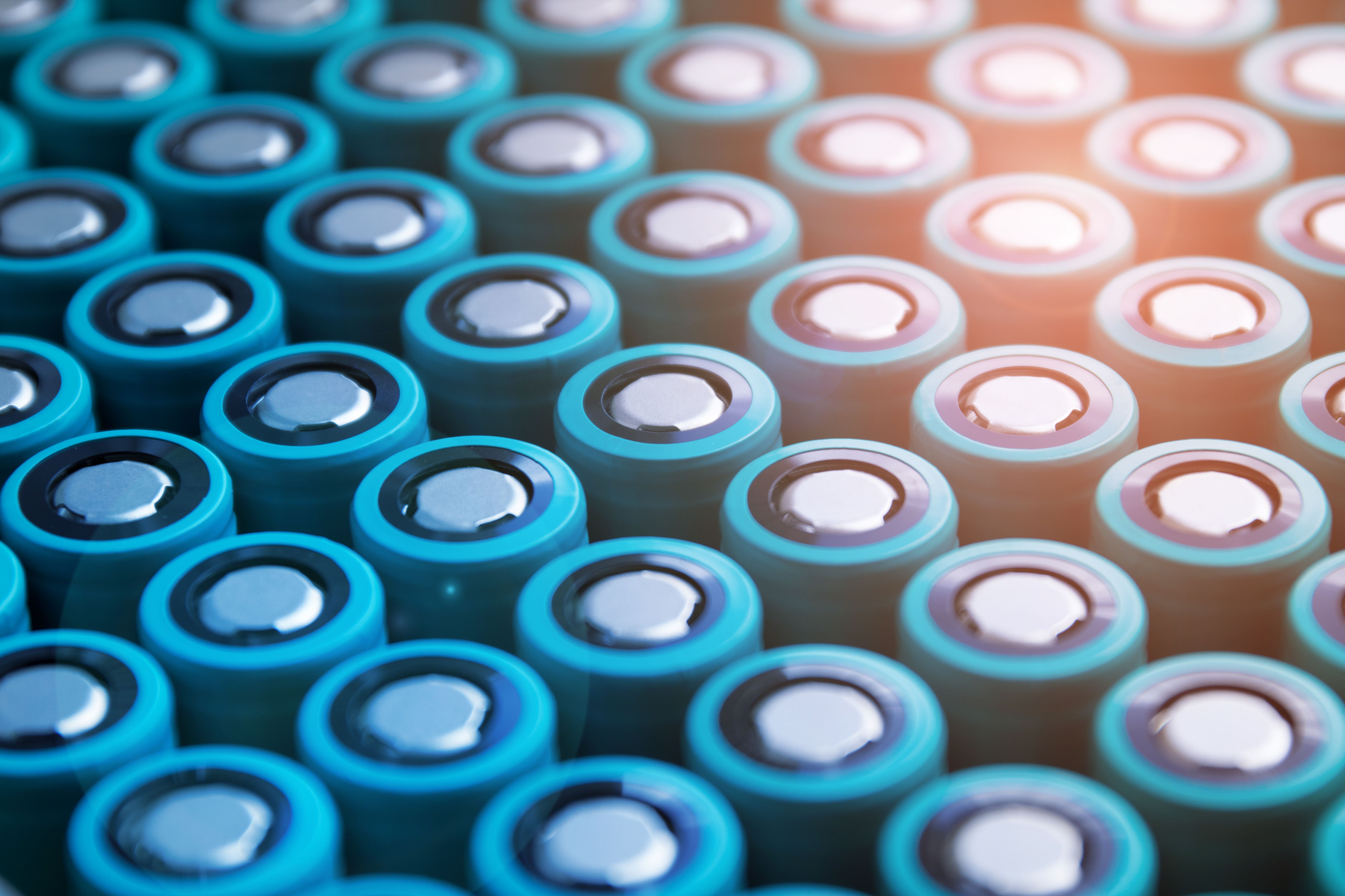 A pack of lithium-ion cells of the 18650 format folded with a positive terminal up. Image with flare effect. | Image Credit: © Павел Печёнкин - stock.adobe.com