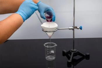 Filter paper in laboratory. Scientists are chemical filtration by filtering through filter paper in a glass funnel, Close up. Pharmacist filtering substance in the lab. | Image Credit: © mehmet - stock.adobe.com