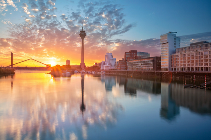 Dusseldorf, Germany. Cityscape image of Düsseldorf, Germany with the Media Harbour and reflection of the city in the Rhine river, during sunrise. | Image Credit: © rudi1976 - stock.adobe.com