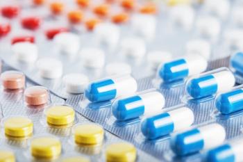 Heap of medical pills in white, blue and other colors. Pills in plastic package. Concept of healthcare and medicine. | Image Credit: © okskaz - stock.adobe.com
