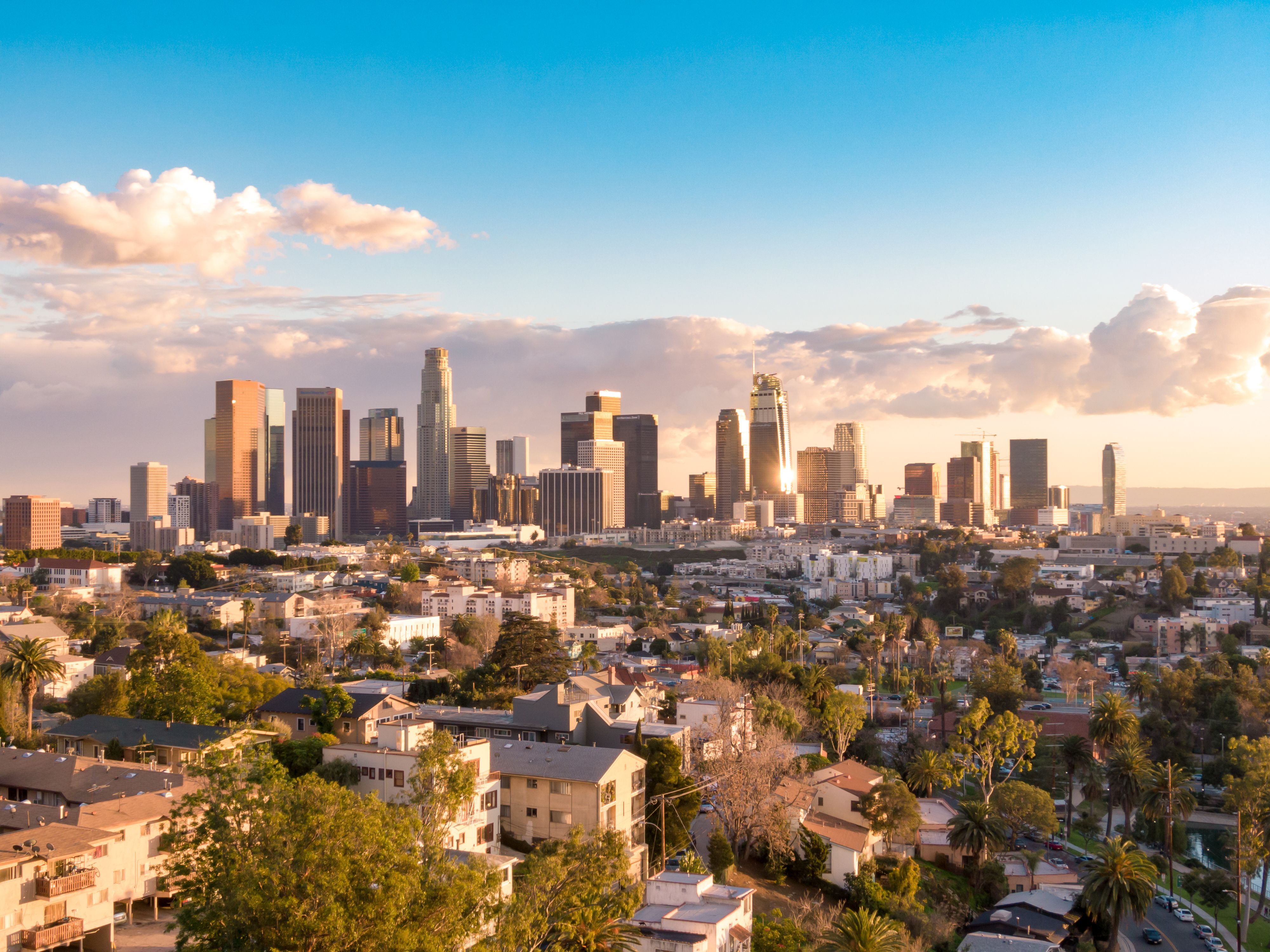 Aerial view of downtown Los Angeles city skyline and skyscrapers on a sunny day. | Image Credit: © Newport Coast Media - stock.adobe.com.