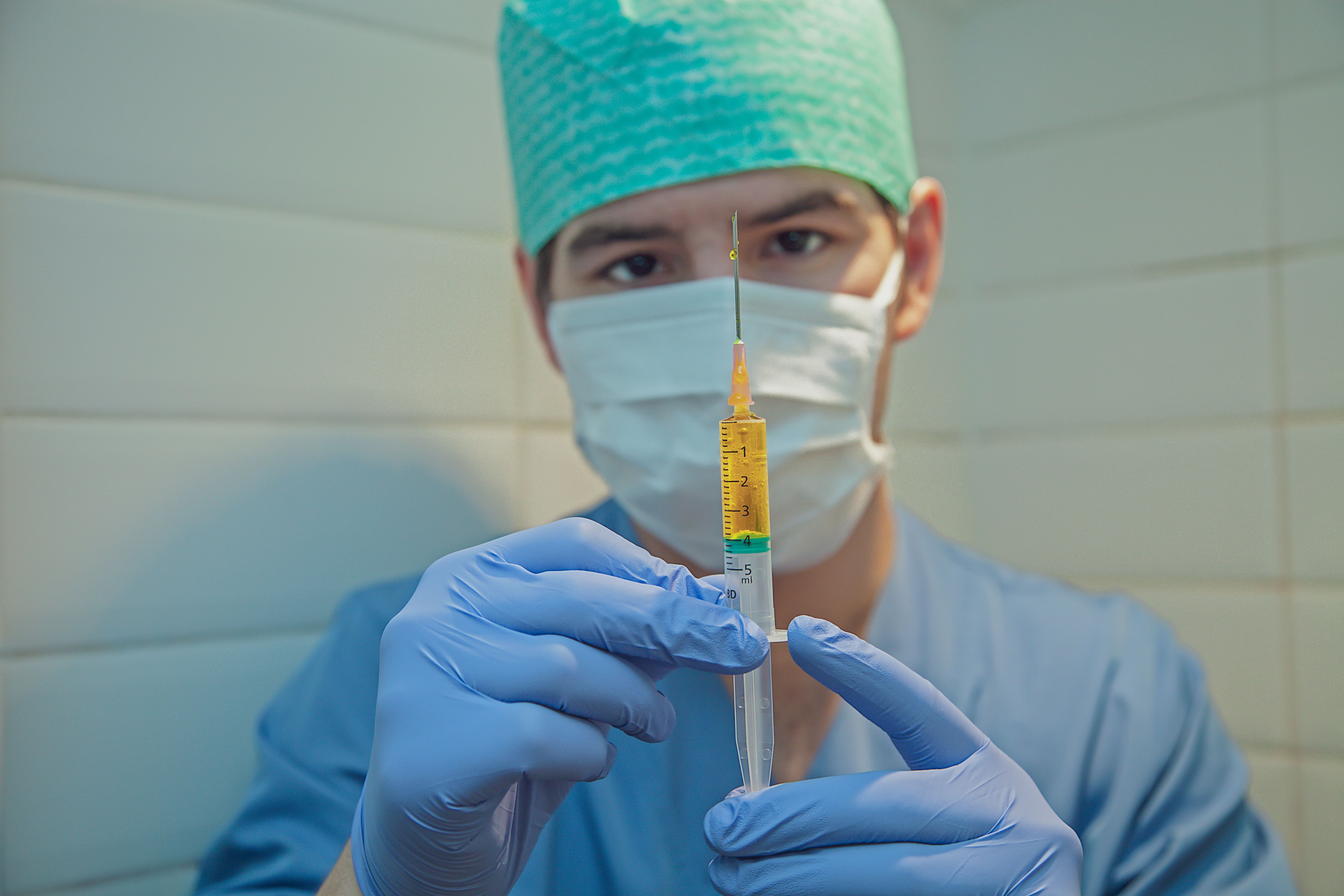 doctor with vaccine needle