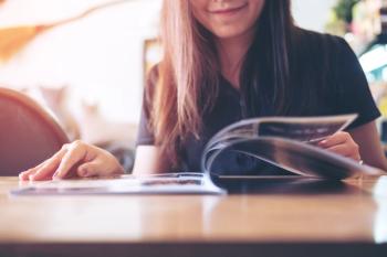 Woman reading magazine