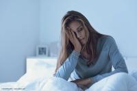 Depressed woman awake in the night | Image Credit: © StockPhotoPro - stock.adobe.com