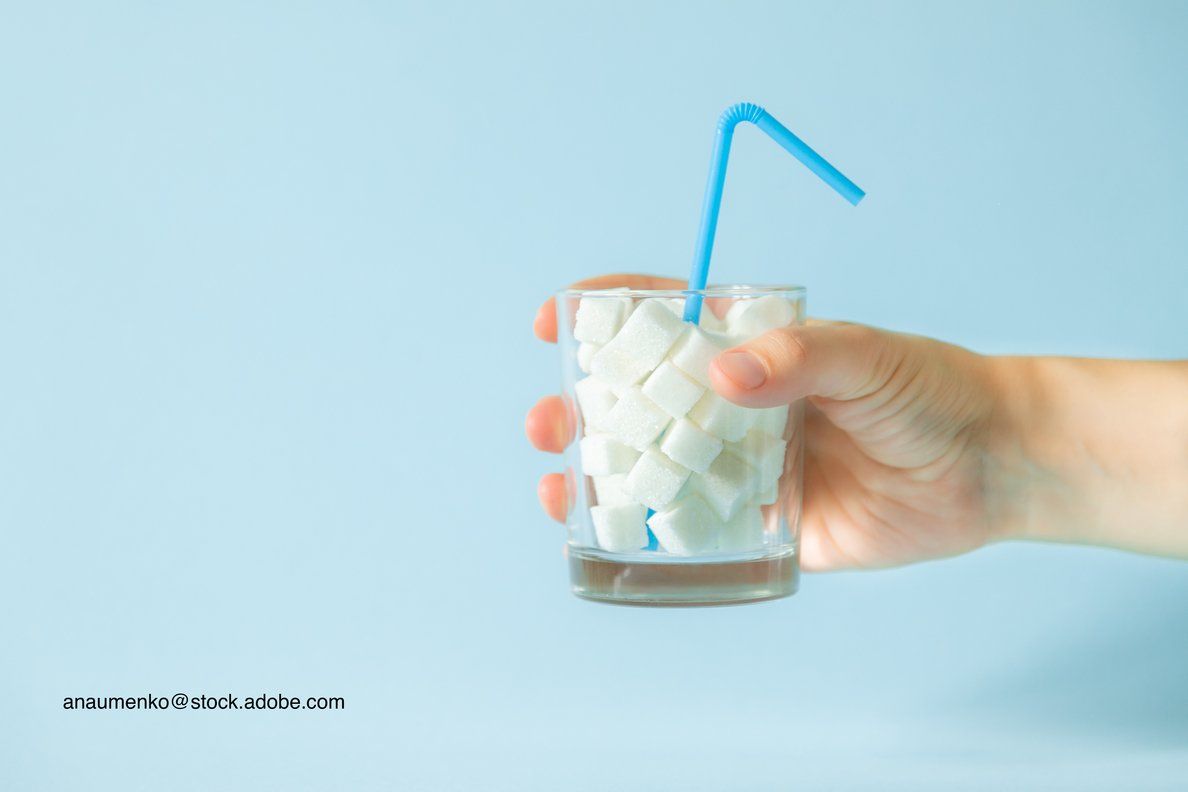 cup full of sugar representing added sugar