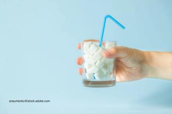 cup full of sugar representing added sugar