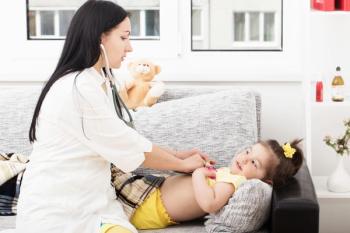 doctor checking on patient with stethoscope