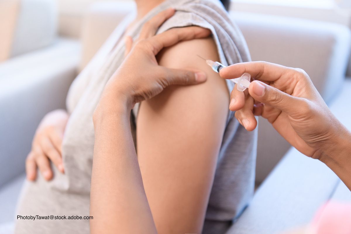 pregnant woman getting a shot