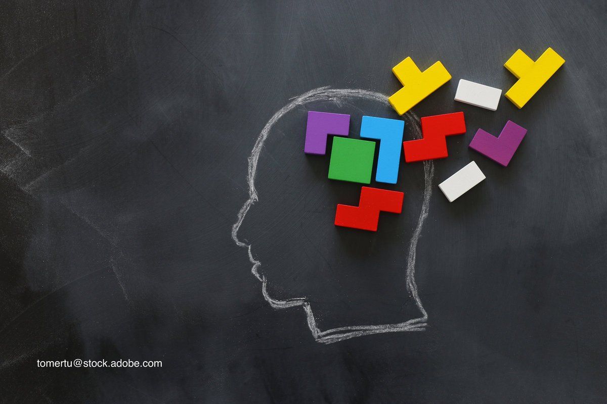 unconnected puzzle pieces representing the brain