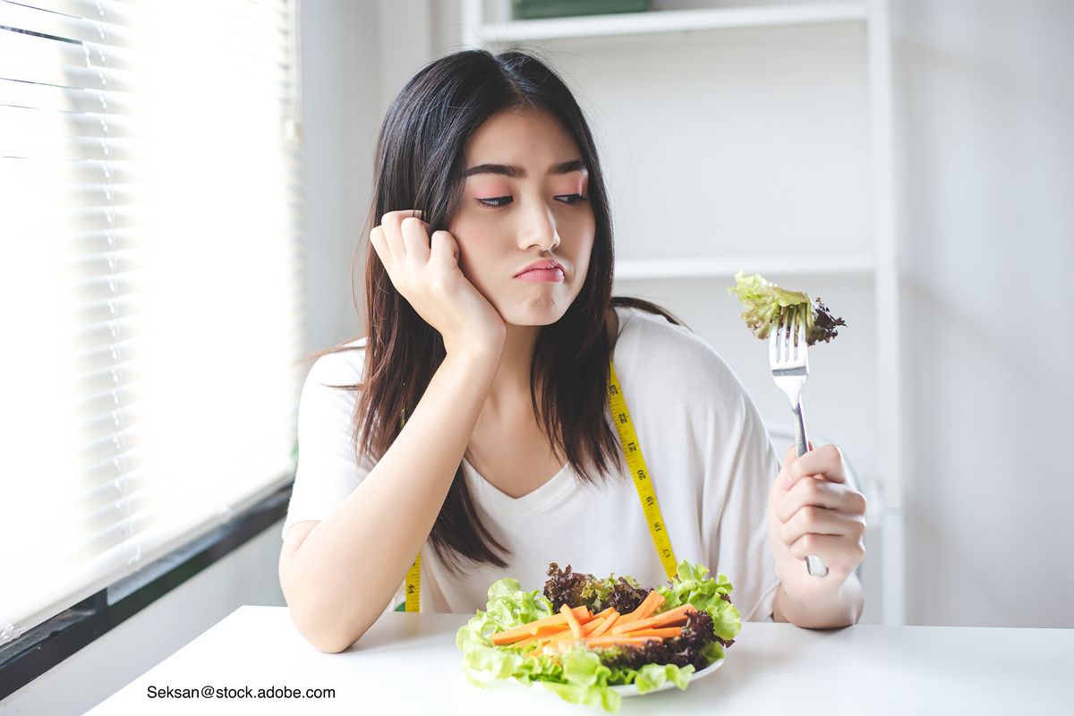 teen who is dieting and paying too much attention to weight while being unhappy