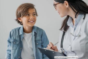 child and doctor during screening