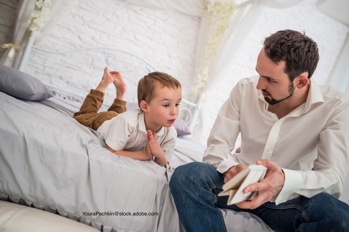 child and father having a serious discussion