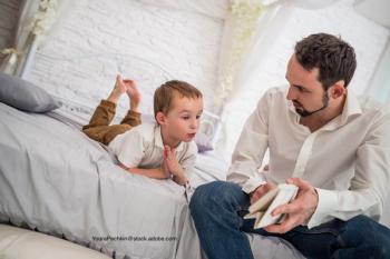 child and father having a serious discussion