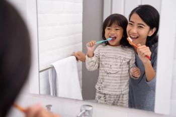 Parent text reminders improve child oral health behaviors | Image Credit: © Odua Images - © Odua Images - stock.adobe.com.