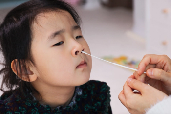 child getting a COVID-19 test