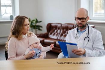 image of doctor and mother with child speaking