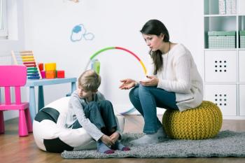 stock photo of boy receiving therapy