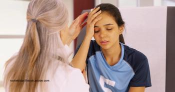 child explaining head injury to a doctor