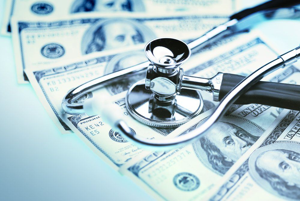 stock image of money and stethoscope