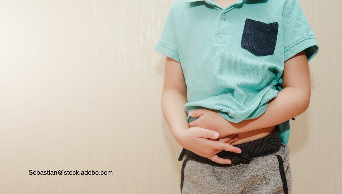 image of child with hands on stomach
