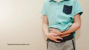 image of child with hands on stomach