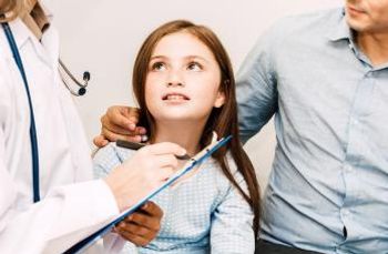 child at doctor for screening