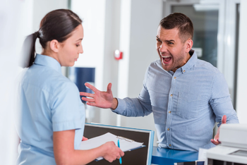 Your receptionist is facing patient aggression | Image Credit: © Lightfield Studios - © Lightfield Studios - stock.adobe.com.