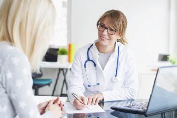 Image of a doctor talking with a patient.