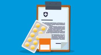 drugs and a prescription pad on a keyboard 