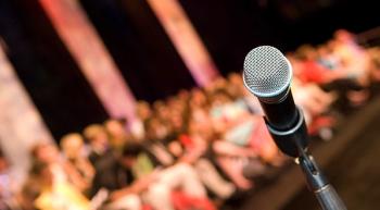 microphone in front of a crowd of people