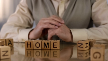 Image of person sitting at home.