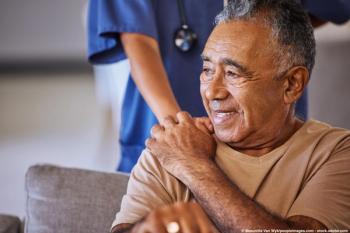 Image of a patient with cancer and their doctor.