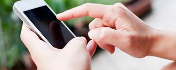 person touching the screen of a smart phone 
